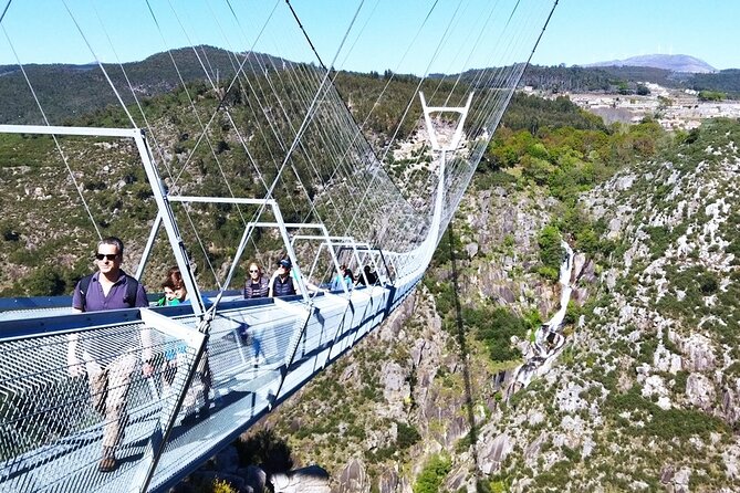 From Porto: 516 Arouca Bridge and Paiva Walkways Guided Tour - Crossing the 516 Arouca Suspension Bridge over the Paiva