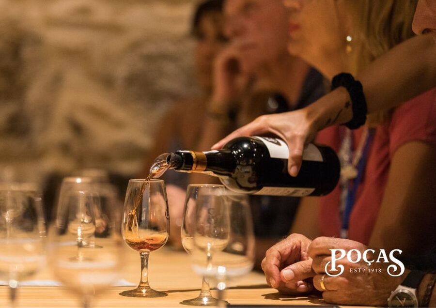 Poças: Guided Tour & Port Wine Tasting with Pastel de Nata - Entering the Poças aging cellar: where time does the work