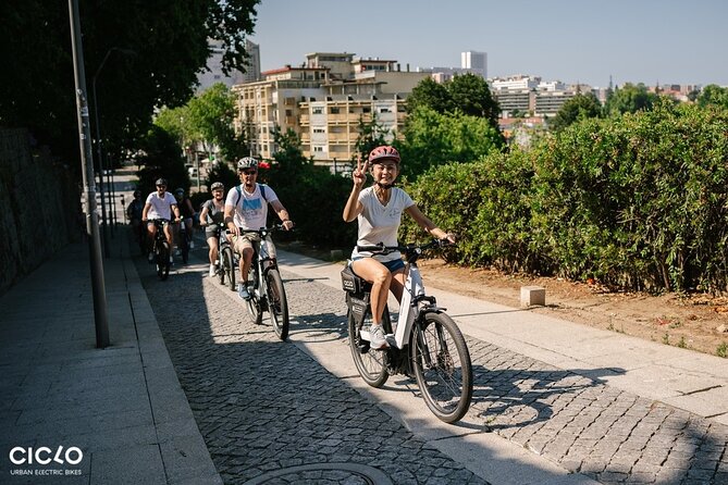 Porto Highlights in 3 Hours E-Bike Tour - Historical, Sightseeing - Clérigos Tower, Palacio de Cristal gardens, and the Luís I Bridge finale