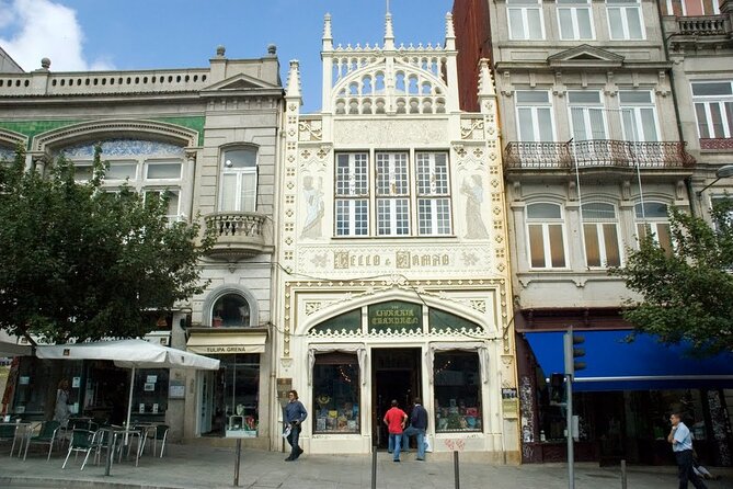 Porto: Private e-Bike Journey Through Historic Center - Torre dos Clérigos and Livraria Lello: baroque drama and a bookshop pause