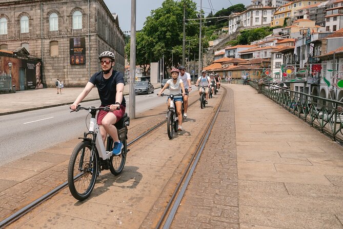 Porto Riverbank E-Bike Tour - Atlantic Coast, Gardens - Massarelos Church and tiled stories: Portugal through blue and gold