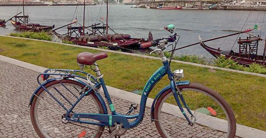 Porto: Self-Guided Bike and Boat Tour with Port Wine Tasting - The rabelo boat cruise: 50 minutes under the six bridges