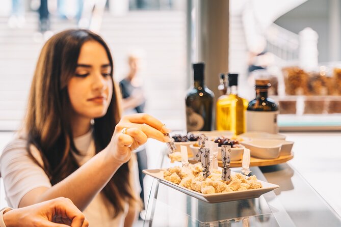 Porto Small Group Gastronomic Food and Wine Tour - Stop 2: Time Out Market Porto for codfish cakes, octopus salad, and white wine