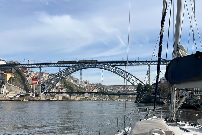 Porto Sunset River Cruise: Douro Magic at Dusk - Port wine cellars and Dom Luís I Bridge: the ironwork payoff