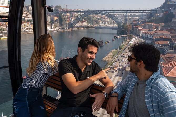 Porto Walking Tour, Lello Bookshop, River Cruise and Cable Car - Douro River cruise: bridge views, Rabelo boats, and colorful riverside scenes