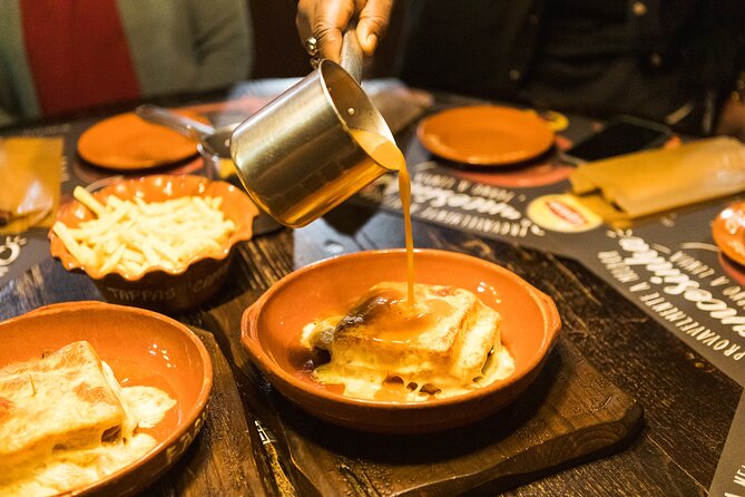 Porto Wine & Dine: Port Wine Cave Food Tour with Eating Europe - Rua Luís de Camões and Alheira: A history lesson with a plate